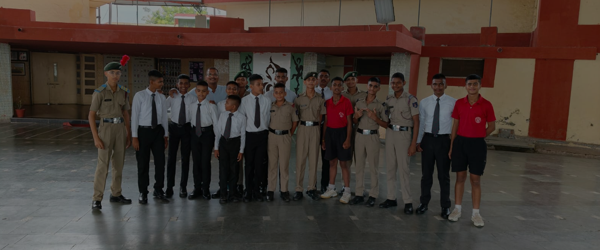 Students in school uniforms during an academy visit